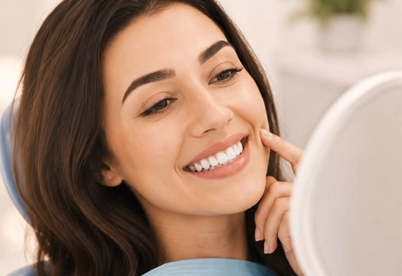 A relaxed patient smiling in the dental chair at Radiant32 Dental Clinic